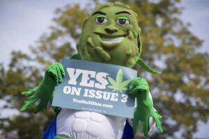 ResponsibleOhio, which is spearheading the effort to legalize marijuana in Ohio, expects to spend more than $20 million on its campaign that features, besides television spots, a mascot named “Buddie” whose head is a marijuana plant bud. PHOTO: JOHN MINCHILLO/ASSOCIATED PRESS