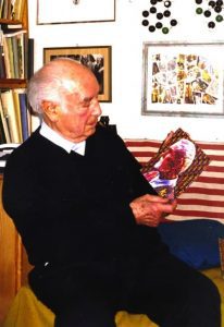 Albert Hofmann holding a Timothy Leary Blotter Art Sheet (via Blotter Barn)