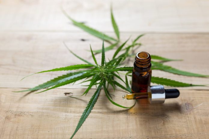 cbd oil and a cannabis leaf
