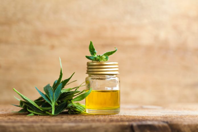 CBD oil and a cannabis leaf
